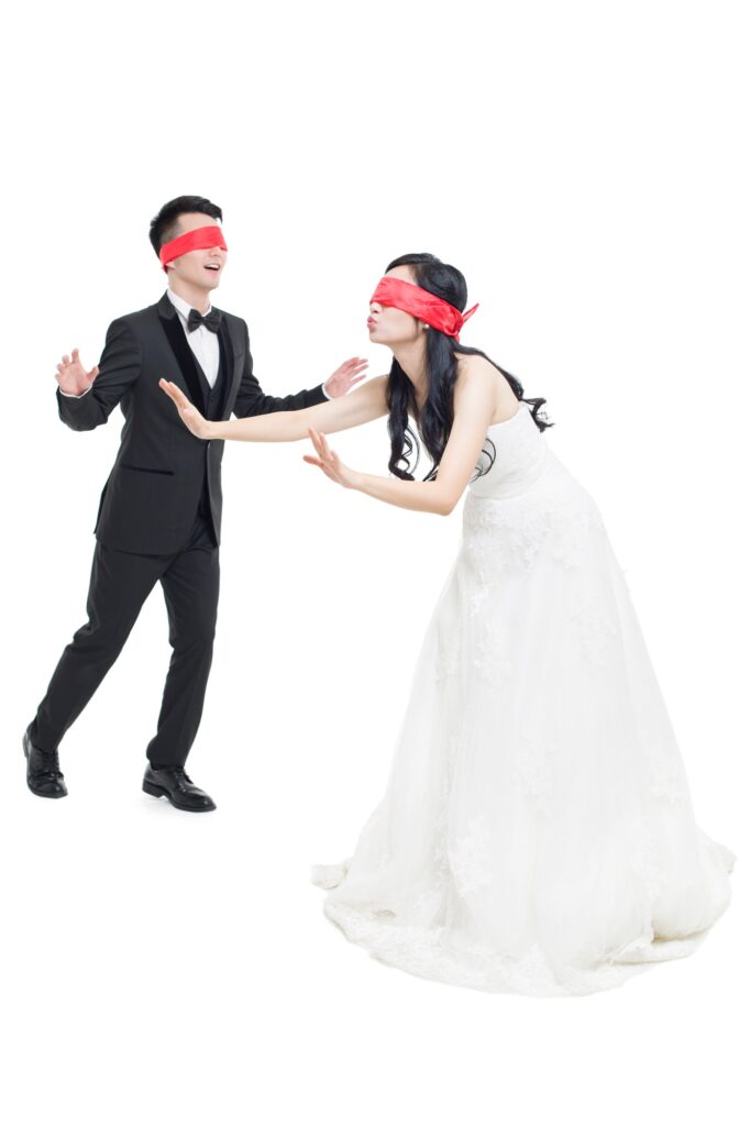 Happy bride and groom playing game together